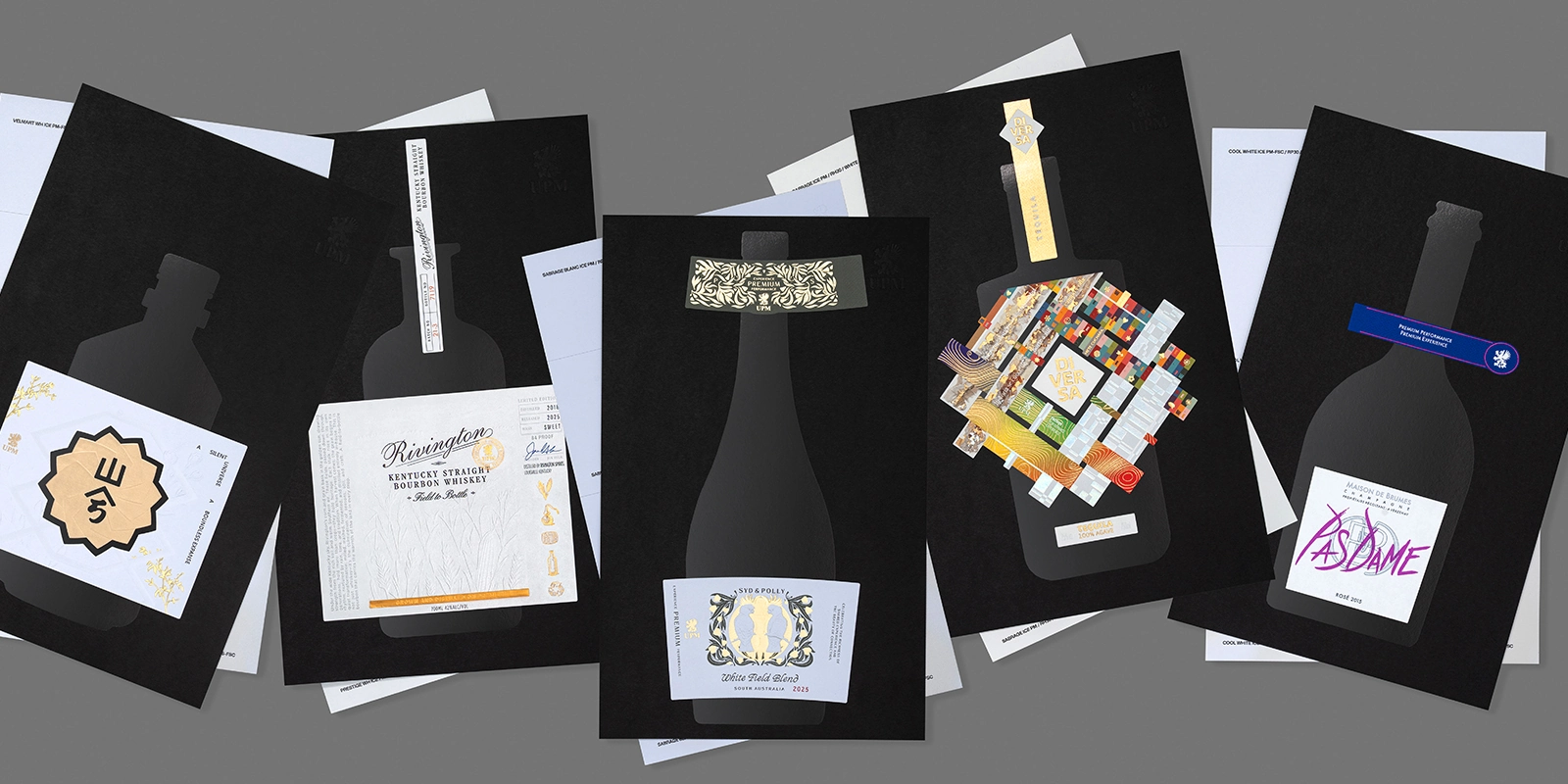Muestras de etiquetas de bebidas espirituosas premium sobre papel especial, incluyendo el diseño de Tequila Diversa.